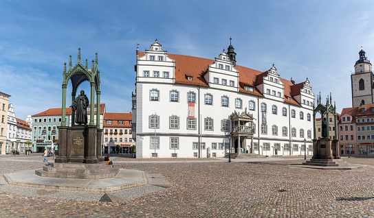 Wittenberg, S-A / Germany - 13 September 2020: the historic market square in Wittenberg with the Luther memorial and the city hall building