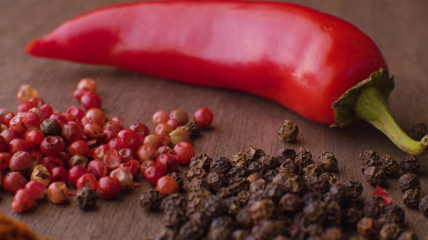 istock Hot pepper pod and peppercorns 1277313264
