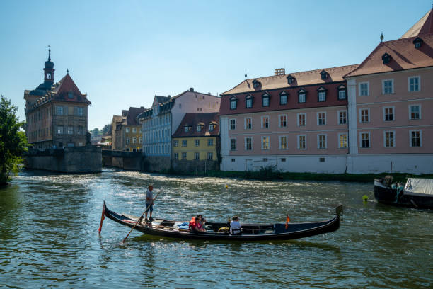 Bamberg, Bavaria / Germany - 15 September 2020: the Regnitz river in Bamberg with a gondola on a ruise