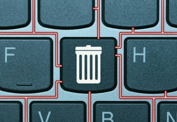 Data deletion concept. Key on a keyboard with trash can icon. Data deletion concept. delete key stock pictures, royalty-free photos & images