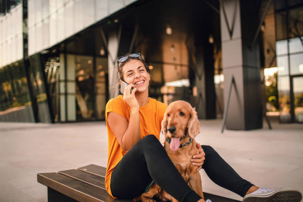 istock Beautiful young woman with her cocker spaniel dog 1277318825
