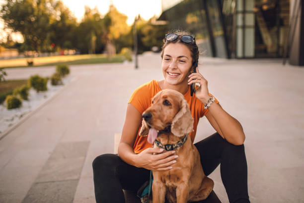 istock Beautiful young woman with her cocker spaniel dog 1277319436