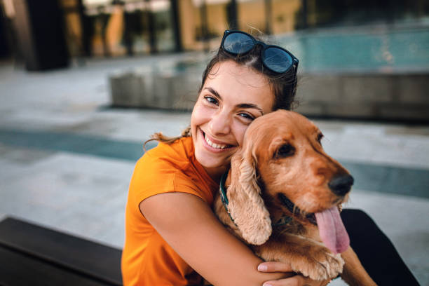 istock Pretty young woman and her cocker spaniel dog 1277320865