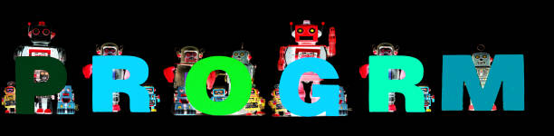 istock retro tin robot toys hold up the word   PROGRAM solated on Black banner 1277320883
