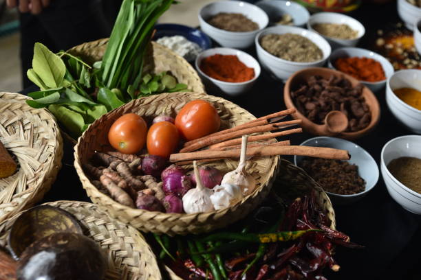 istock Variety of spices and herbs on kitchen wooden table 1277321343