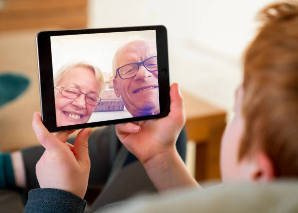 istock Boy talking with grandparents on video call 1277322109