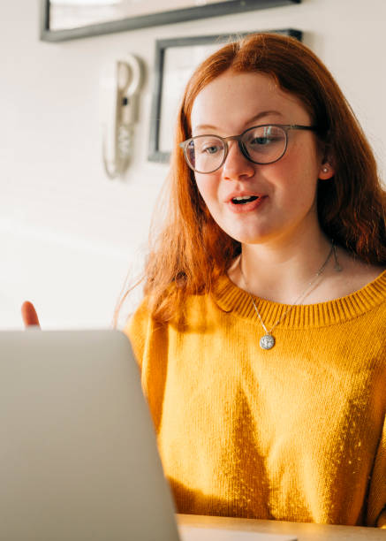 istock Girl video calling through laptop in quarantine 1277322901