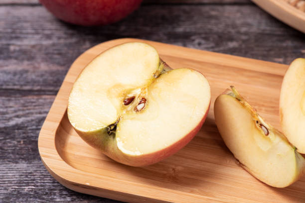 istock Ripe red apples  with clipping path on wooden table 1277323268