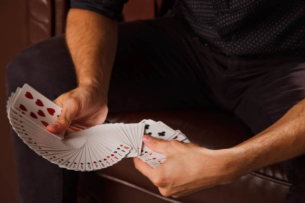 istock Clever hands of magician on black background 1277324178
