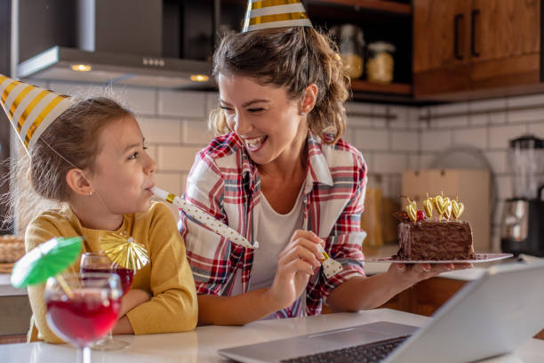 istock Mother and daughter having online celebration at home 1277325193