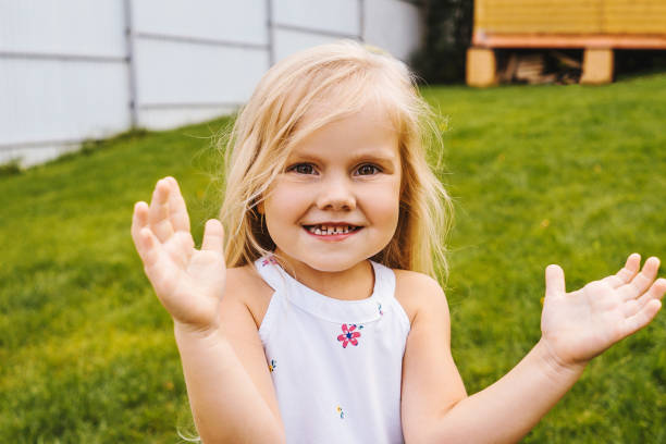 istock Little girl having fun on grass. 1277325276