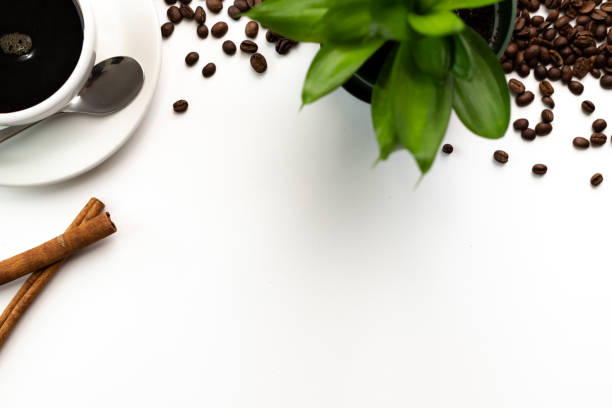 istock Coffee beans background with with copy space and white cup of coffee 1277325844