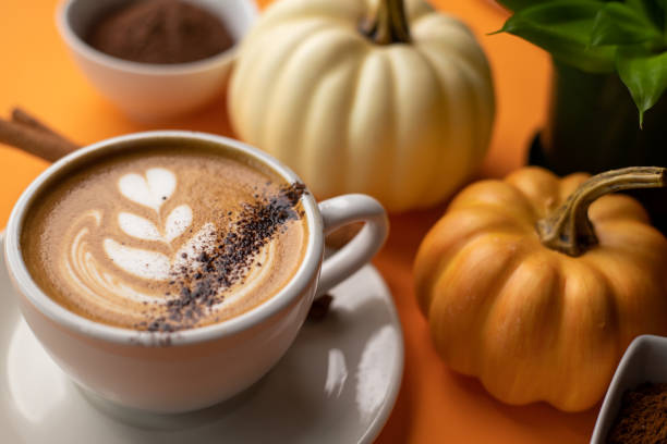 istock Pumpkin spice latte on a orange background 1277325986