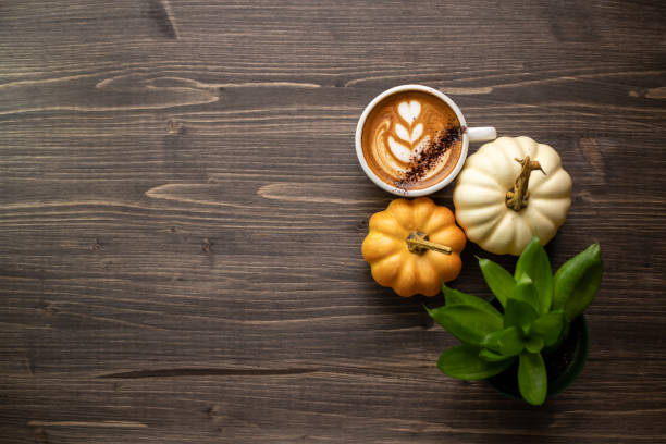 Pumpkin spice latte on a wooden background