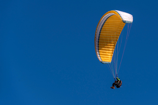 paragliding hang glider on the sky background