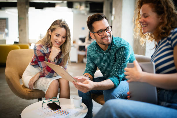 istock Business people having fun and chatting at workplace office 1277327860