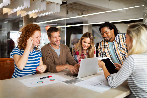 istock Group of business people and software developers working as a team in office 1277328396