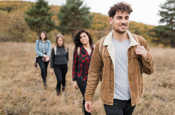 istock Happy young friends on hiking trip 1277329738