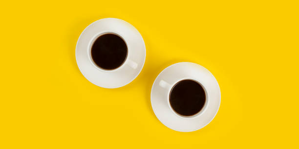 istock Top view image of coffee cup on yellow background flat lay copy space 1277331106