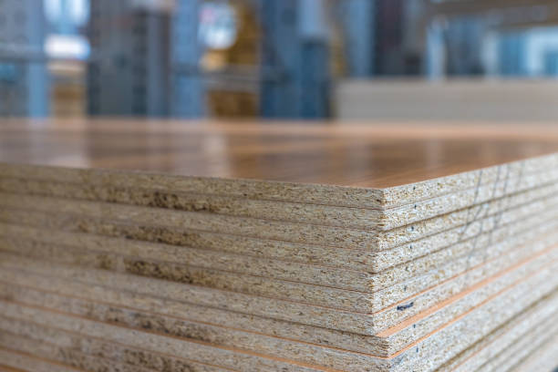 istock Chipboard sheets with decorative coating in the store, texture. Lumber is sold at the supermarket or warehouse. Close-up with copy space. 1277331734