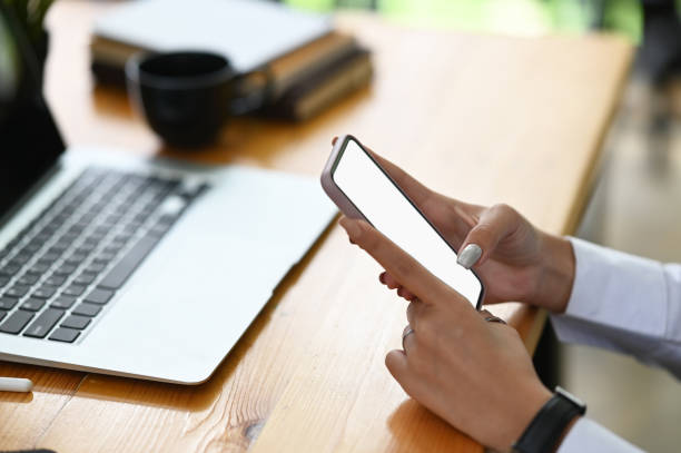 istock Closeup empty screen of smartphone on woman hands with clipping path on display. 1277334706