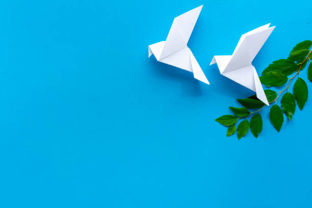 istock Origami birds are flying, overhead top view 1277334795