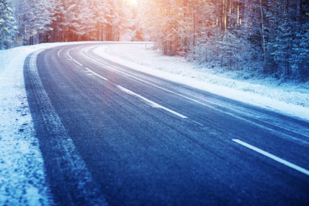 istock Winter road, covered with snow on sunny day 1277334846