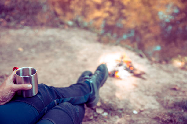Drinking Tea by the Campfire on River bank
