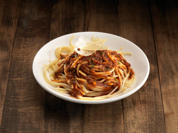 istock Italian pasta with sauce on white plate. 1277335616