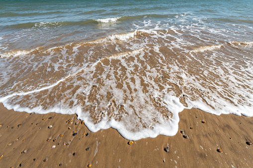 Waves on a sandy beach