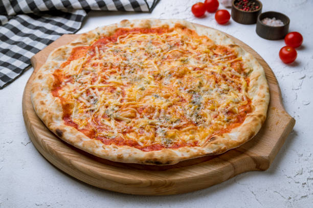 istock Pizza Quattro formaggi on white concrete table 1277337378