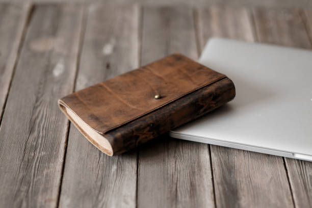 istock Working space, Laptop andnotepad on wooden Background desk 1277338410
