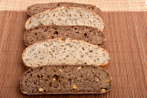 Fresh baked bread and wheat in a studio setting