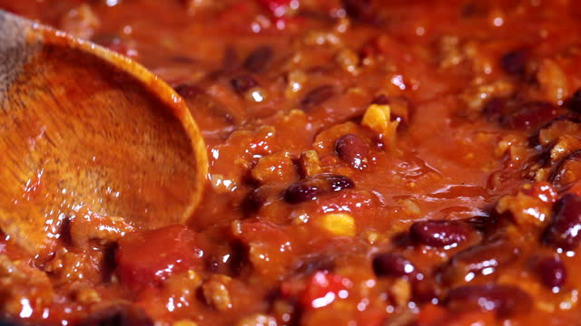 Cooking chili con carne in a frying pan.