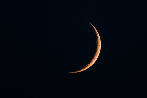 Moon in the night sky just after the New Moon during the waxing crescent towards becoming full again.
