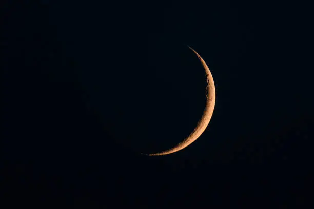 Photo of Moon in the night sky just after the New Moon during the waxing phase