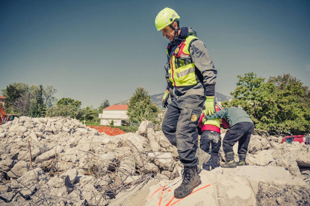 rescuer search trough ruins of building - rescue worker imagens e fotografias de stock