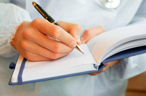 istock close-up of a hand writing in a Notepad 1277343972
