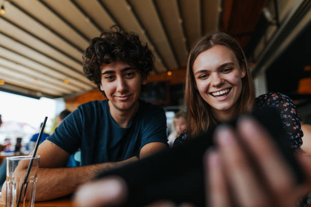 istock Young couple having fun in sidewalk cafe 1277345533