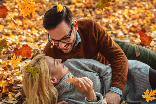 istock Romantic couple in autumn park 1277348054