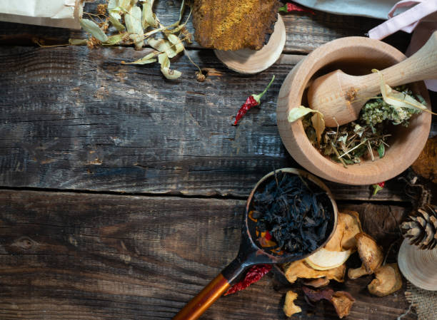 istock table of herbalist and healer healing herbs 1277348714