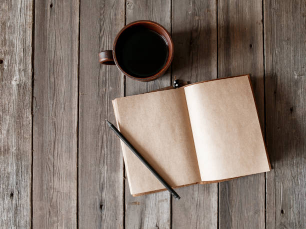istock Office desk with blank screen smartphone,pen,notebook and coffee cup on wood table.Top view with copy space.Office supplies and gadgets on desk table.Working desk table concept.Flat lay image 1277348748