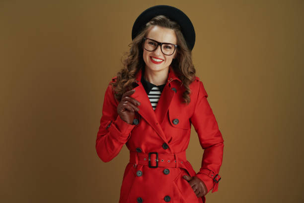 istock smiling trendy woman isolated on bronze background 1277350601