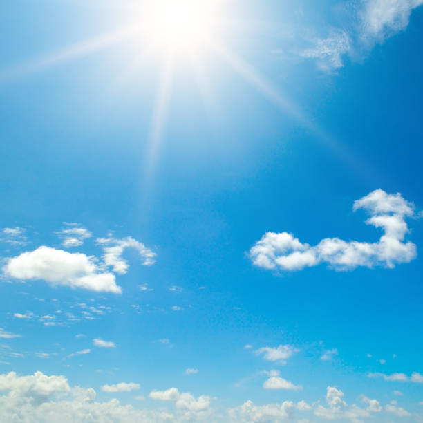 istock Sunny background, blue sky with white clouds and sun. 1277351300