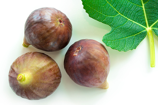 Fresh ripe figs - white background