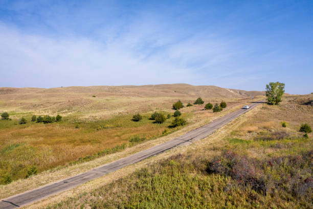 istock narrow highway in Nebraska Sandhills 1277355156