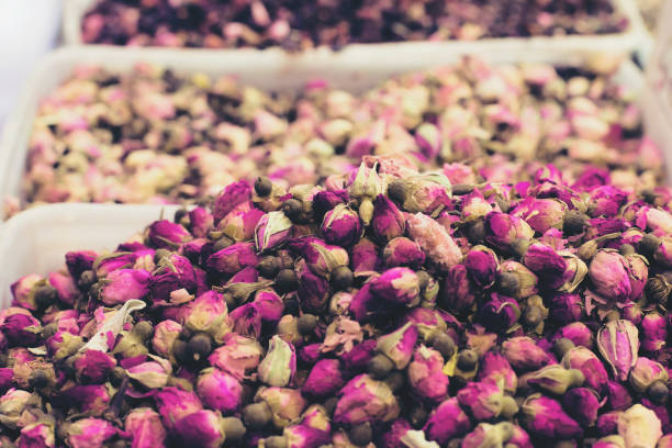 Dried rose buds close up at the market. Aromatherapy concept. Selective focus