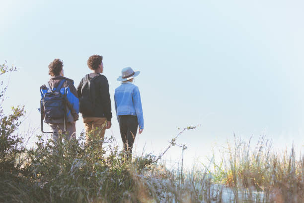 istock Friends hiking, exploring and viewing the ocean 1277357024