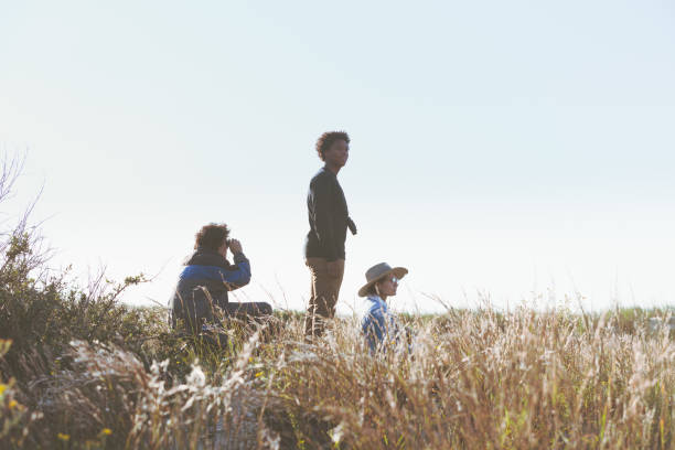 istock Friends hiking, exploring and viewing the ocean 1277357045