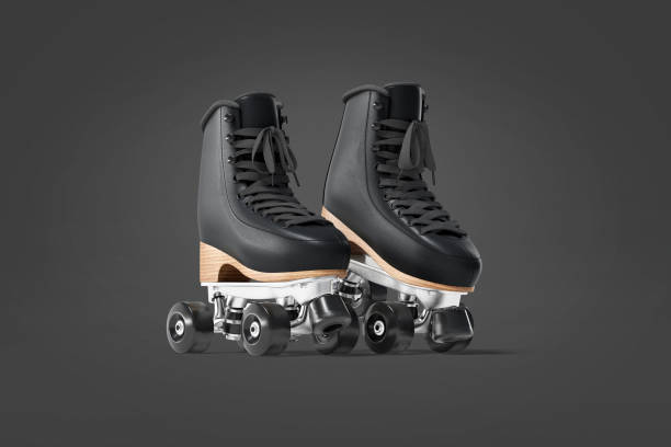istock Blank black roller skates mockup pair on tiptoe, dark background 1277359243